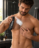 Man spraying Regenex mousse on his chest